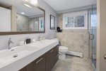 Shares full bathroom on the lower level with dual sinks & stand-up shower